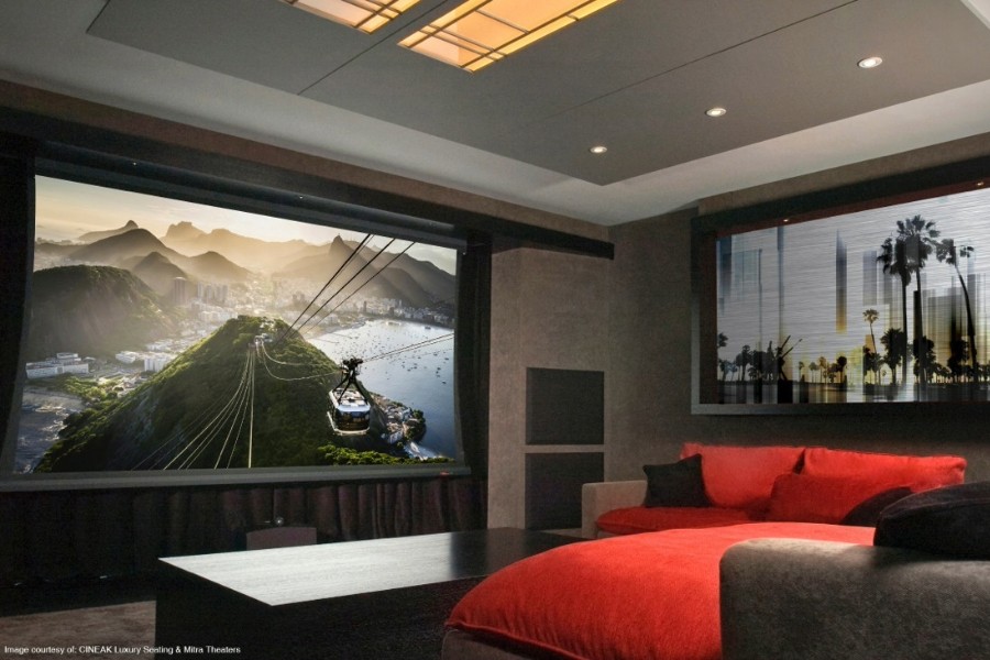 A home theater room featuring a large screen for movie-watching.